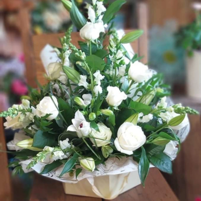 Simple elegance - A selection of classic elegant white flowers presented in a beautiful hatbox .. choice of colours available