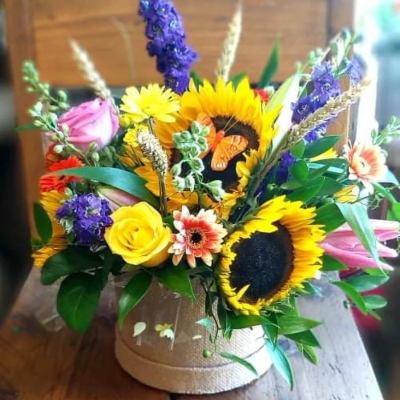 Wild meadow - Make someone smile today with our cheery meadow selection arranged in a hat box .. colours and content may vary